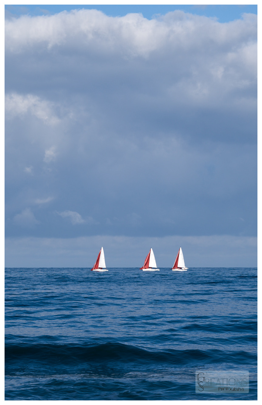three sailing boats